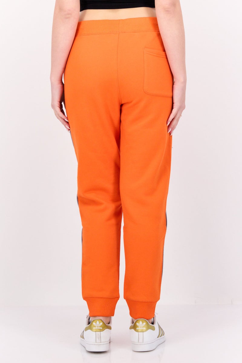 Aape BY *A BATHING APE® Women Regular Fit Brand Logo Jogger Pants, Orange - Image 3