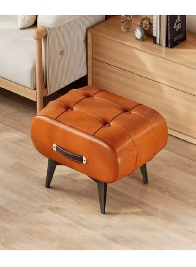 Raffine Mid-Century Modern Tufted Leather Ottoman Featuring Rich Cognac Upholstery, Decorative Side Handle Accent, and Angled Wooden Legs for Versatile Use as a Footrest, Accent Stool, or Compact Seating in Stylish Living Spaces 40 x 34 x 30 cm. - Image 1