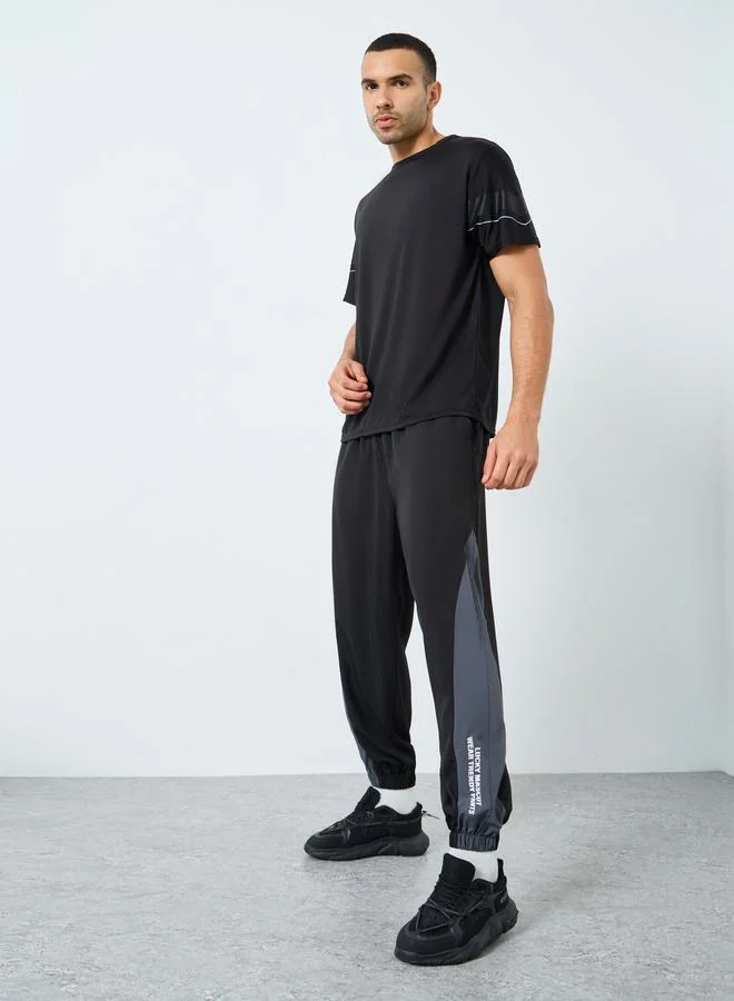Styli Active Men Black Placement Print Regular Fit Track Pants with Side Panel