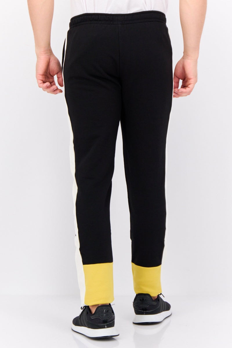 PUMA سروال تدريب ضيق للرجال مع شعار مطرز، أسود - Image 4