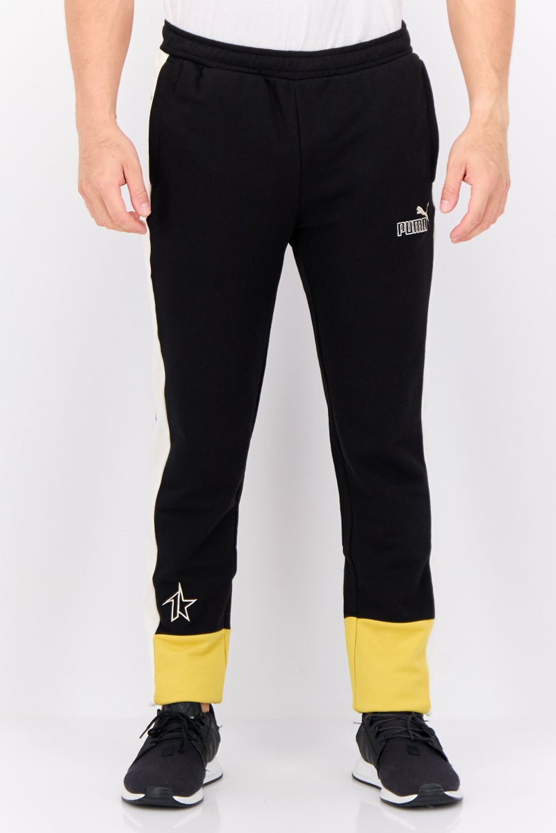 PUMA سروال تدريب ضيق للرجال مع شعار مطرز، أسود - Image 1