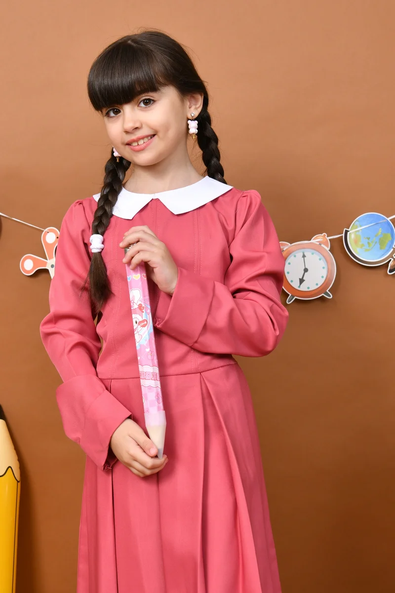 HAWRAA ABAYA Nouran Pink Apron: A simple, classic design with a white collar and soft pleats.