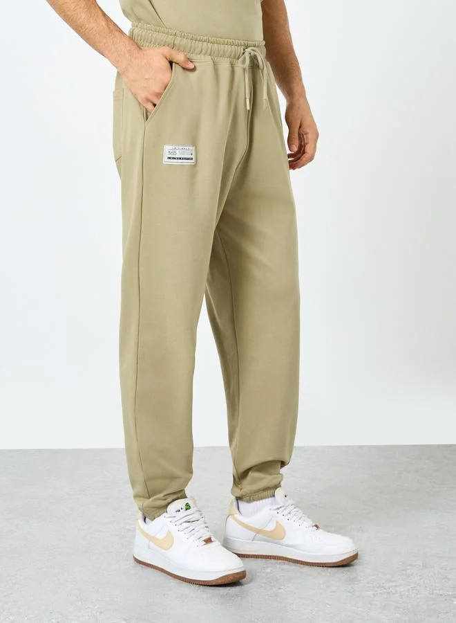Styli Styli Badge Oversized T-Shirt and Elasticated Joggers Co-Ords