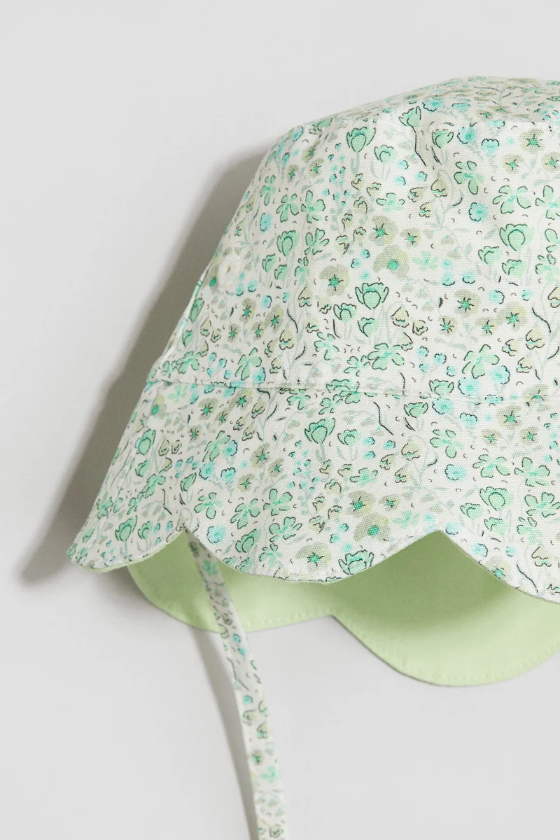 اتش اند ام قبعة باكيت بحواف مموجة