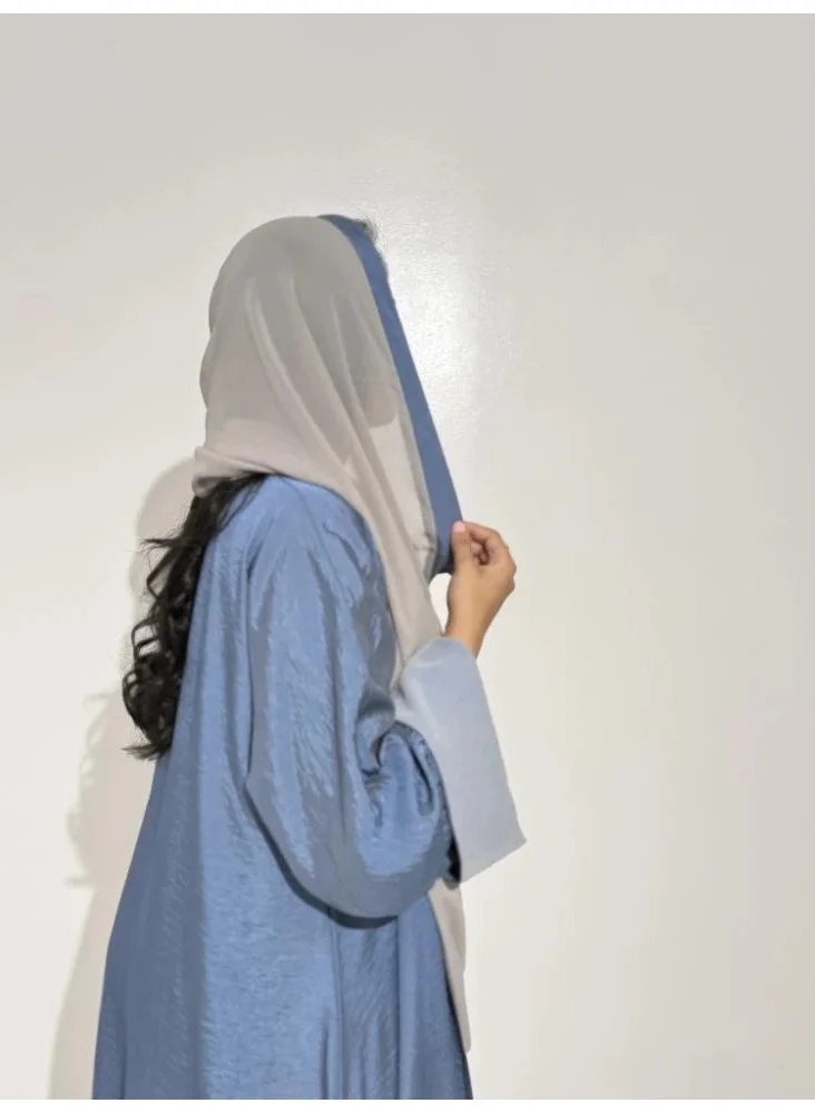 Tori-abaya Sky-blue silk abaya with wide sleeves.