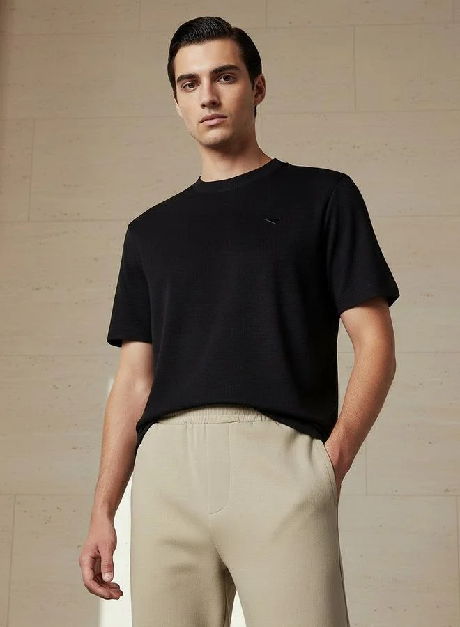 لي كوبر Lee Cooper Men Regular Fit Crew Neck Short Sleeves Badge Detail T shirt