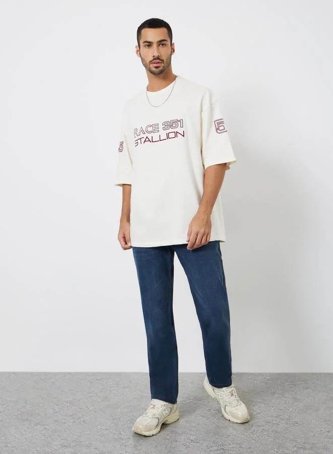 Styli Men Beige Graphic Print Boxy Fit T-Shirt