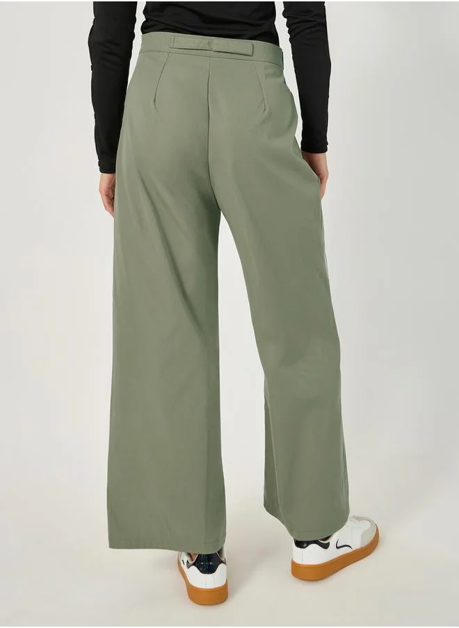ستايلي Straight Fit Mid Rise Cross Panel Pants with Belt