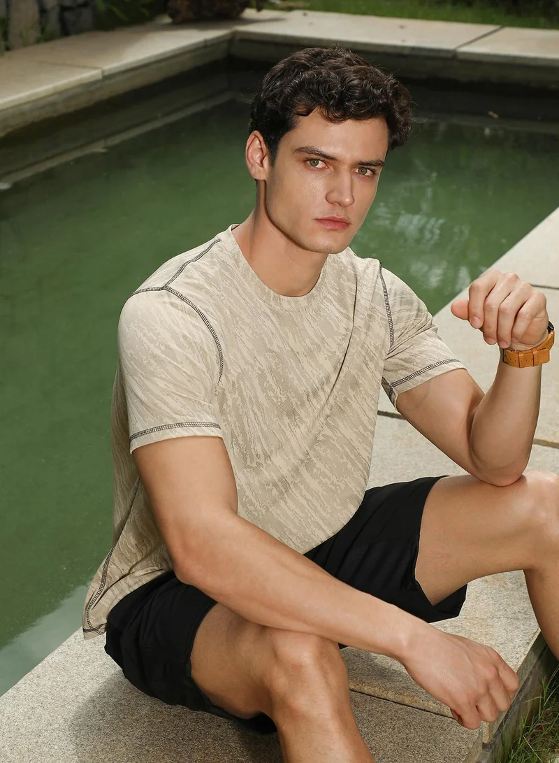 Campus Sutra Men's Sand Beige Plash-Imprint Activewear T-Shirt