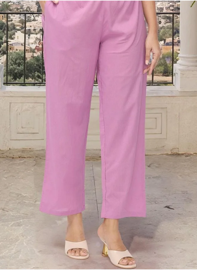 ISHIN Lilac Women Lilac Cotton Kurta Set with Embroidered pattern Tunic and Palazzo features a Round neckline and Three-Fourth Sleeve secured with Elastic closure and styled in Straight Fit ideal for Festive moments — crafted to elevate your special moments.