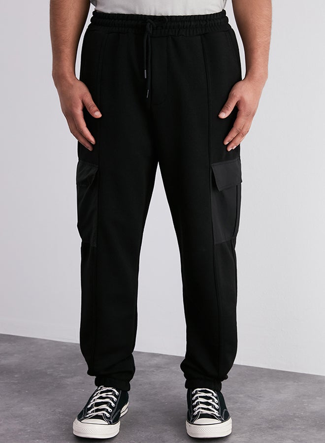 Black Oversize/Wide Cut Cargo Pocket Elastic Leg Sweatpants TMNSS24EA00003