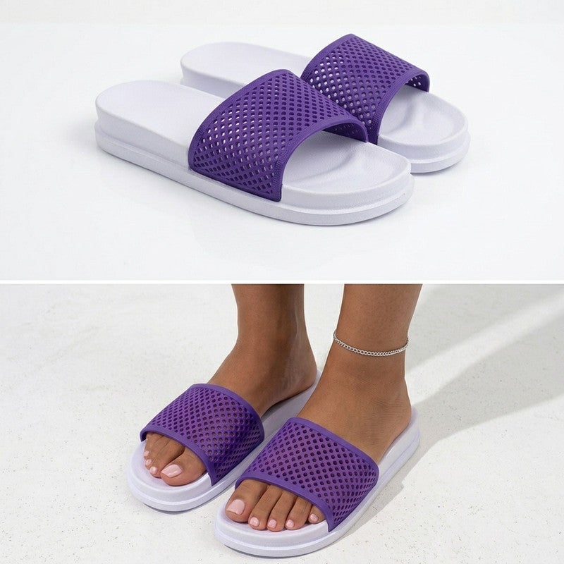 These stylish women's slides combine two subtle colors: the outsole and footbed are light and delicate, while the wide upper strap features a perforated mesh design in a contrasting, bright color. The perforated section provides continuous ventilation, and the sole is made of a flexible, lightweight, and shock-absorbing material for all-day comfort.