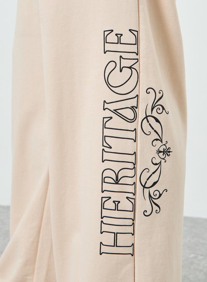 Styli Men Beige Graphic Print Oversized Joggers - Image 4