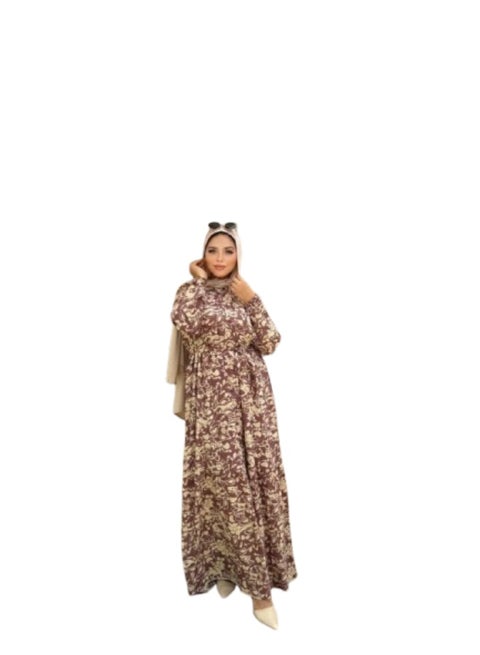 Fresca hijab dress with a floral print, decorative buttons running the length of the dress, and a waist belt.