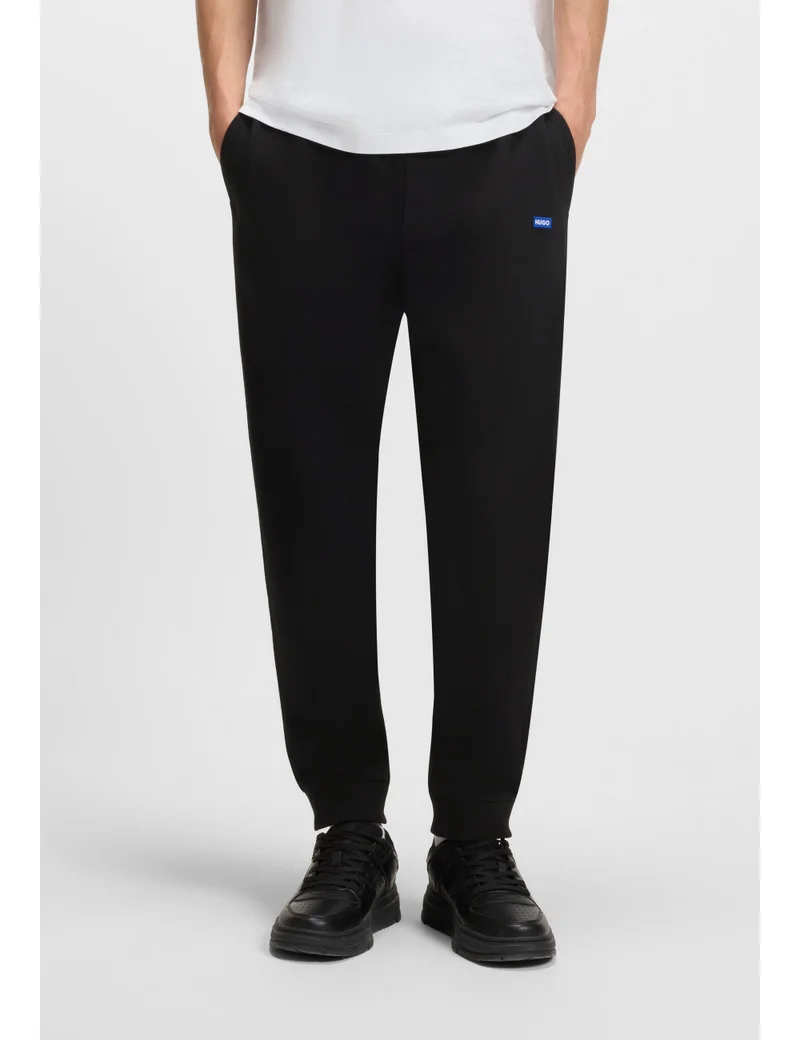 HUGO Cotton-terry tracksuit bottoms with blue logo patch