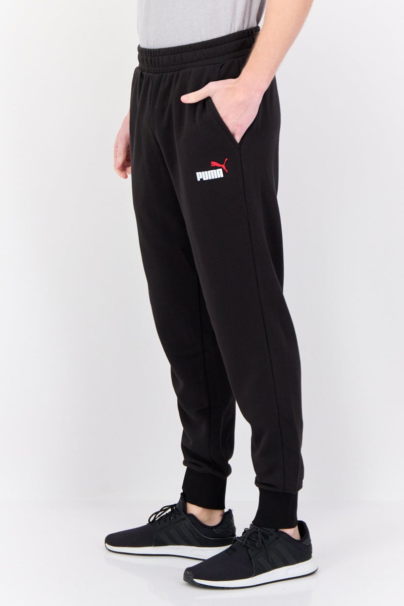 PUMA Men Sports Wear Fit Brand Logo Outdoor Sweatpants, Black - Image 3