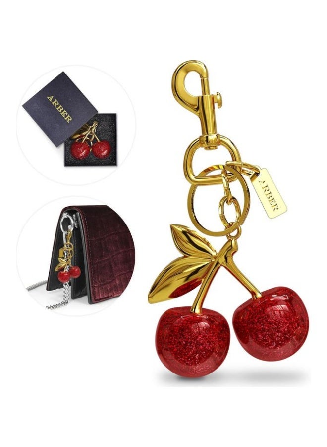 A realistic cherry-shaped keychain for wallets or bags, featuring a large clip, cute bag charms, a gold trunk chain, and versatile bag accessories. - Image 1