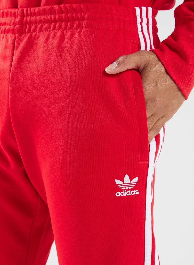 Adidas Originals red adidas SST TP Red Originals Men PANTS for Men | Best Price UAE