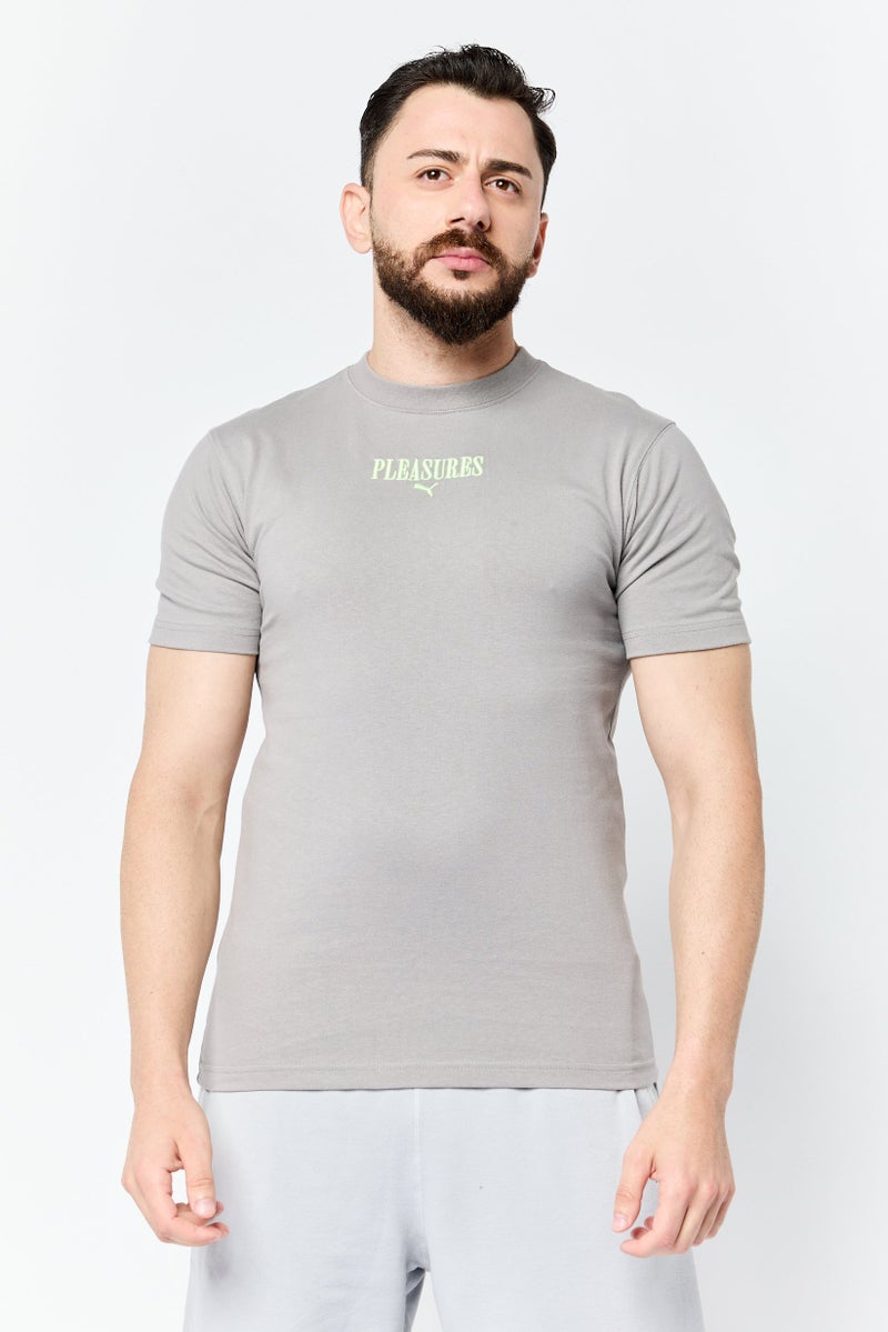 Puma x Pleasures Men Sportswear Fit Short Sleeve Outdoor T-Shirt, Light Grey - Image 1