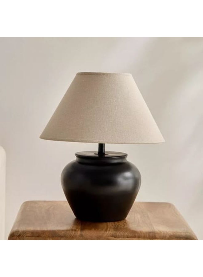 Table lamp with a white fabric cap, black ceramic base, and an E27 LED bulb. - Image 1