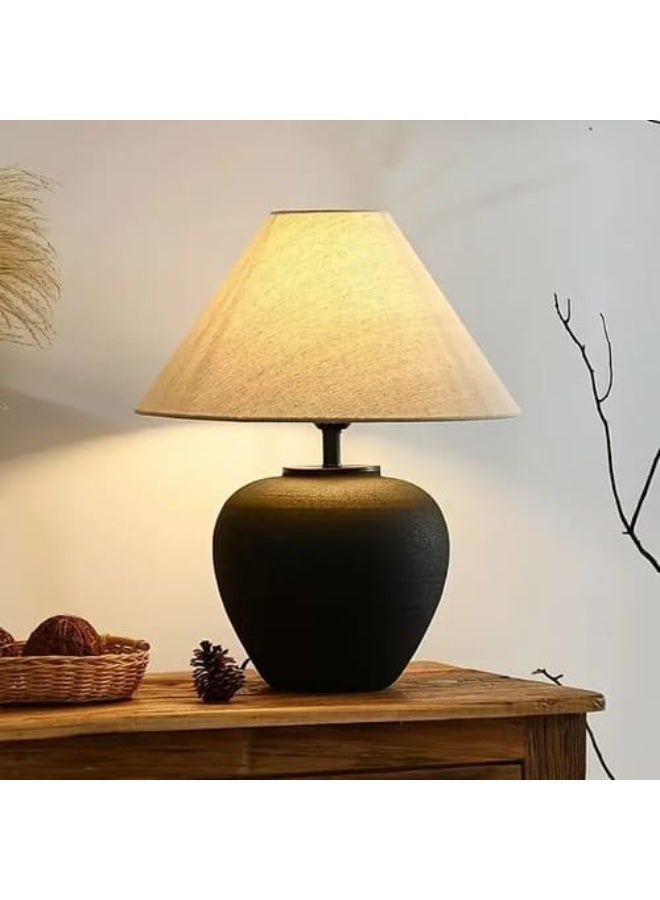 Table lamp with a white fabric cap, black ceramic base, and an E27 LED bulb. - Image 2