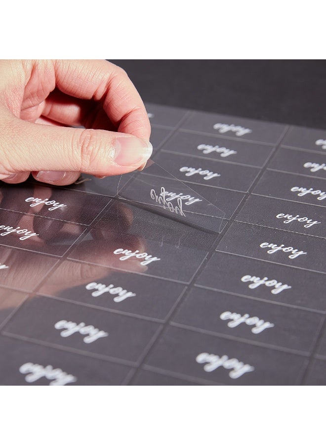 Restaurantware Label Tek 1.9 x 1 Inch Enjoy Juice Bottle Labels, 100 Water-Resistant Labels For Bottles - Self-Adhesive, Clear With White Font, Plastic Bottle Stickers, For Drink Pouches,