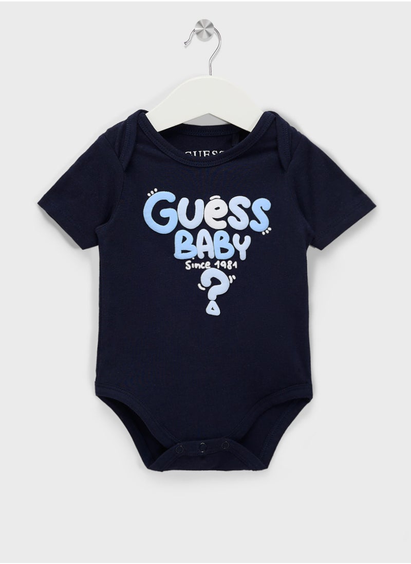GUESS Kids  2 Pack Bodysuit, Bib, Socks & Pants Gift Set  - Image 2