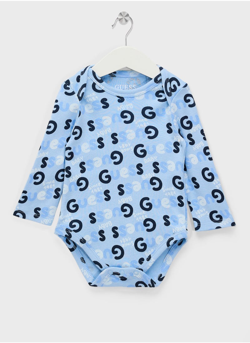 GUESS Kids  2 Pack Bodysuit, Bib, Socks & Pants Gift Set  - Image 3