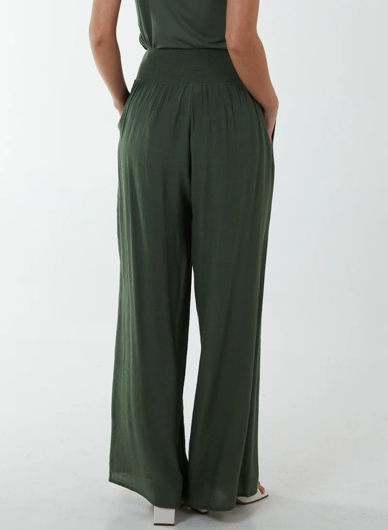 بلو فانيلا بنطلون واسع الساق بخصر مزموم