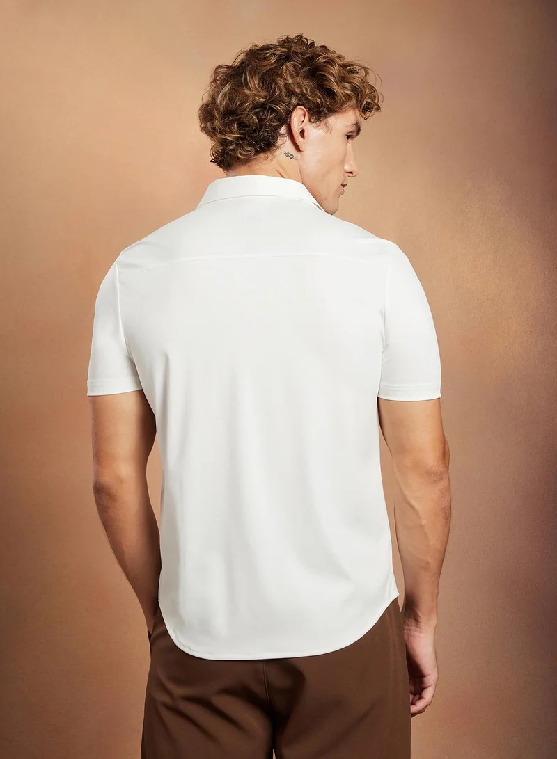 Campus Sutra Campus Sutra Men's Chalk White Seamless Solid Shirt For Casual Wear | Spread Collar | Short Regular Sleeves | Button Closure | Shirt Crafted With Comfort Fit For Everyday Wear