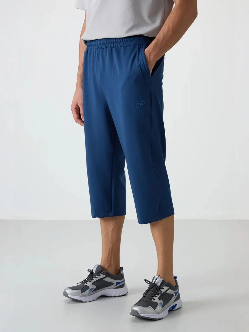 تومي لايف TOMMY Men's Mid-waist Wide-leg Capri Shorts