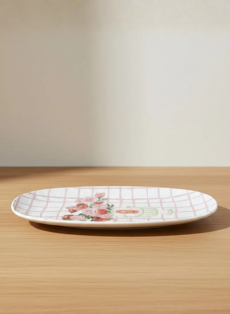 سوق الزعفران نقشة مزخرفة على طبق فخاري بلون وردي