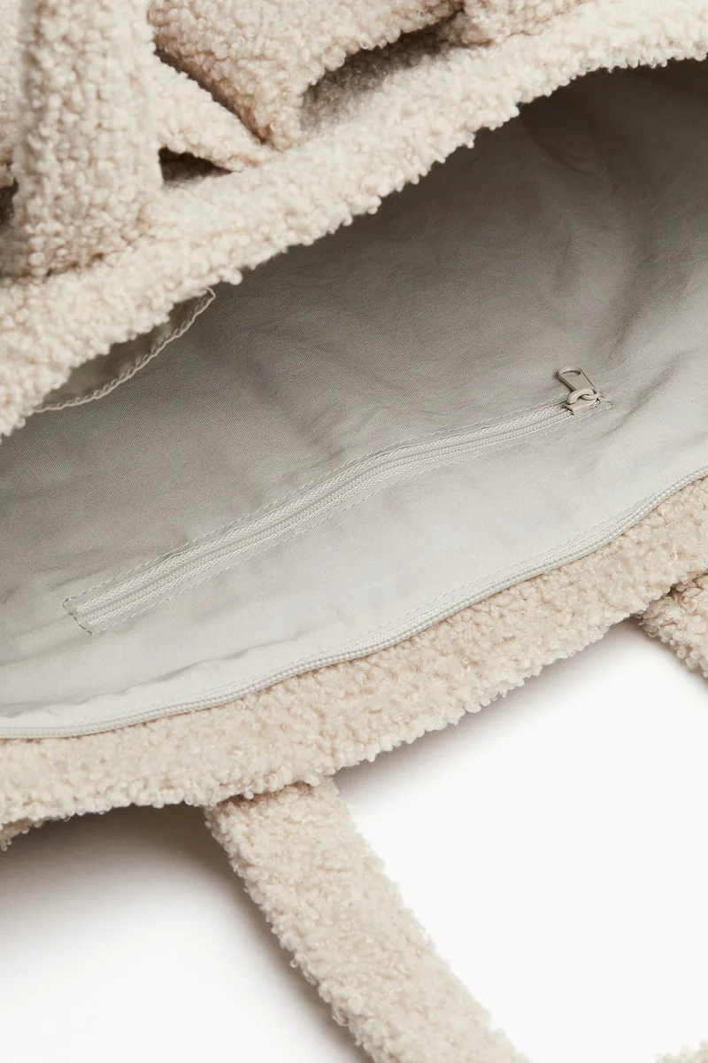 H&M Fluffy nursing bag