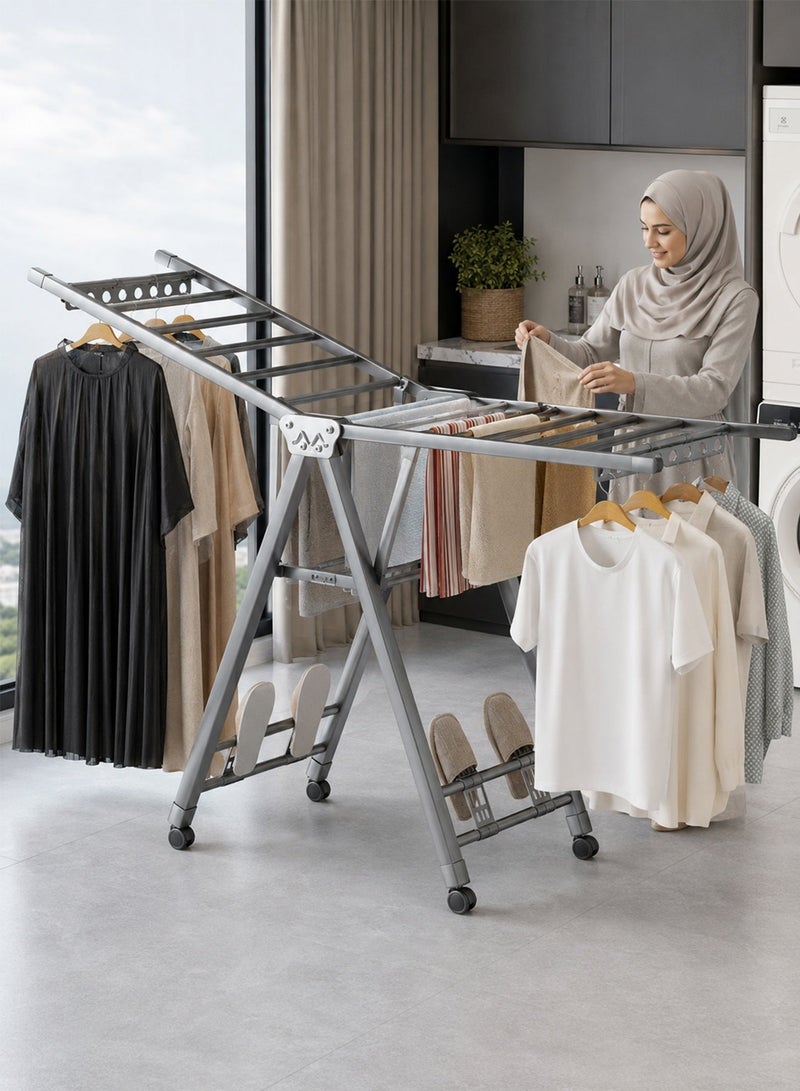 فافاري منشر ملابس قابل للطي 1.7 متر، حامل تجفيف ملابس بطبقتين مع 4 حوامل أحذية، فتحات مانعة لانزلاق العلاقات وعجلات، منشر غسيل كبير متحرك للاستخدام الداخلي والخارجي، رمادي - Image 1