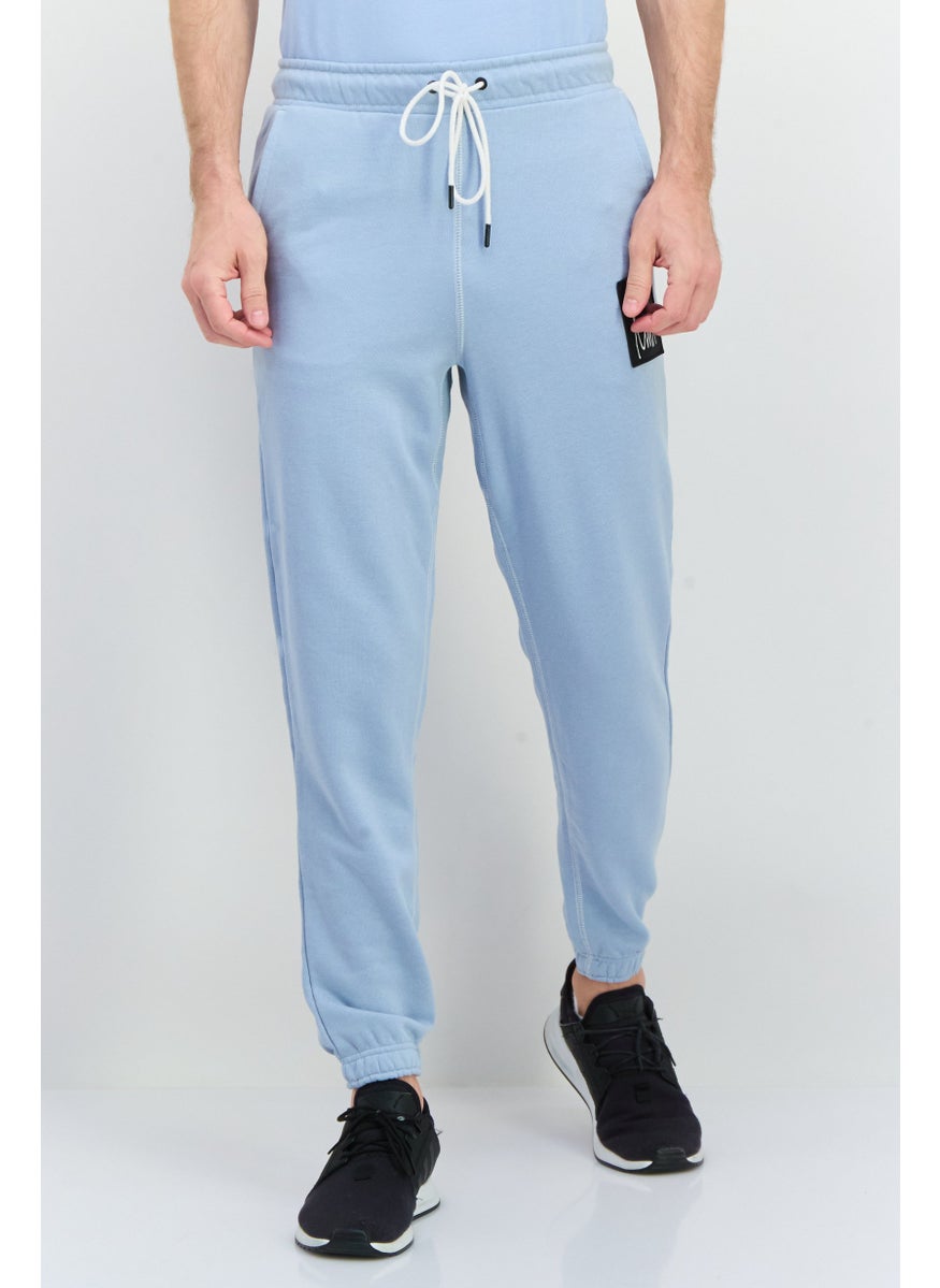 PUMA Men Sportswear Fit Outdoor Sweatpants, Light Blue  - Image 1