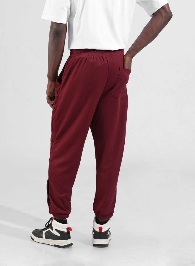 The Indian Garage Co Men Relaxed Fit Embroidered Side Pocket Mid-Rise Joggers