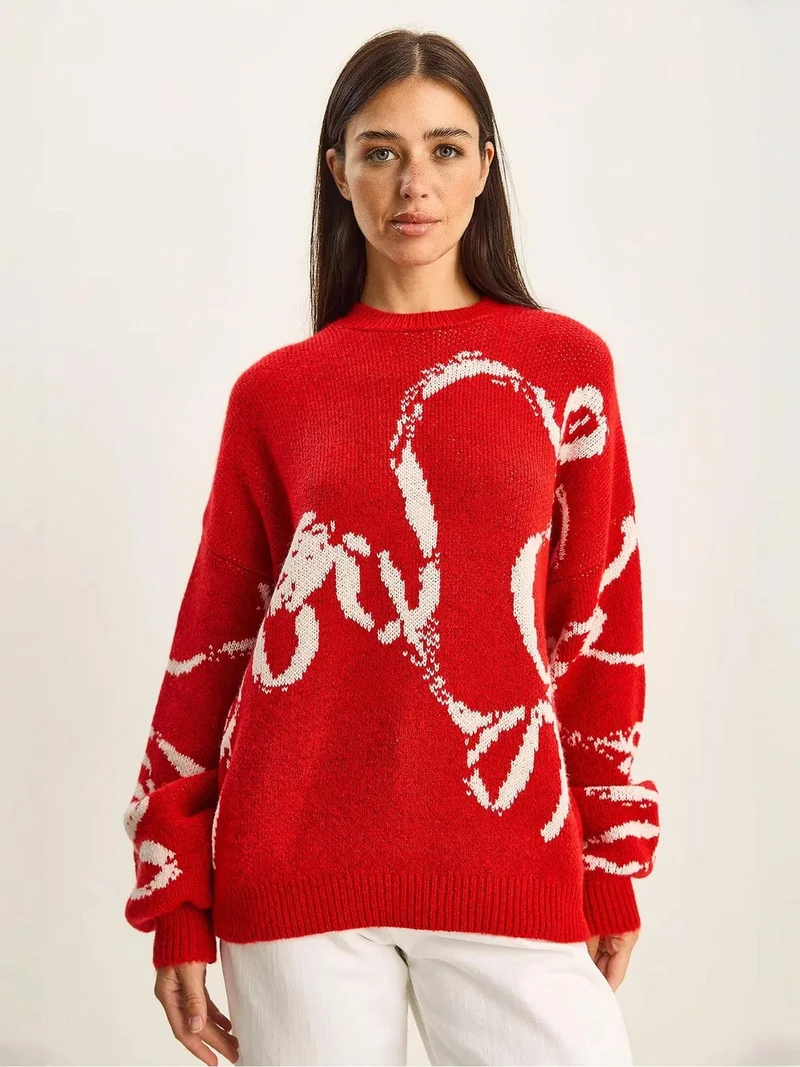 بيانكو لوتشي كنزة صوفية كبيرة الحجم بطبعة وياقة دائرية من لوتشي