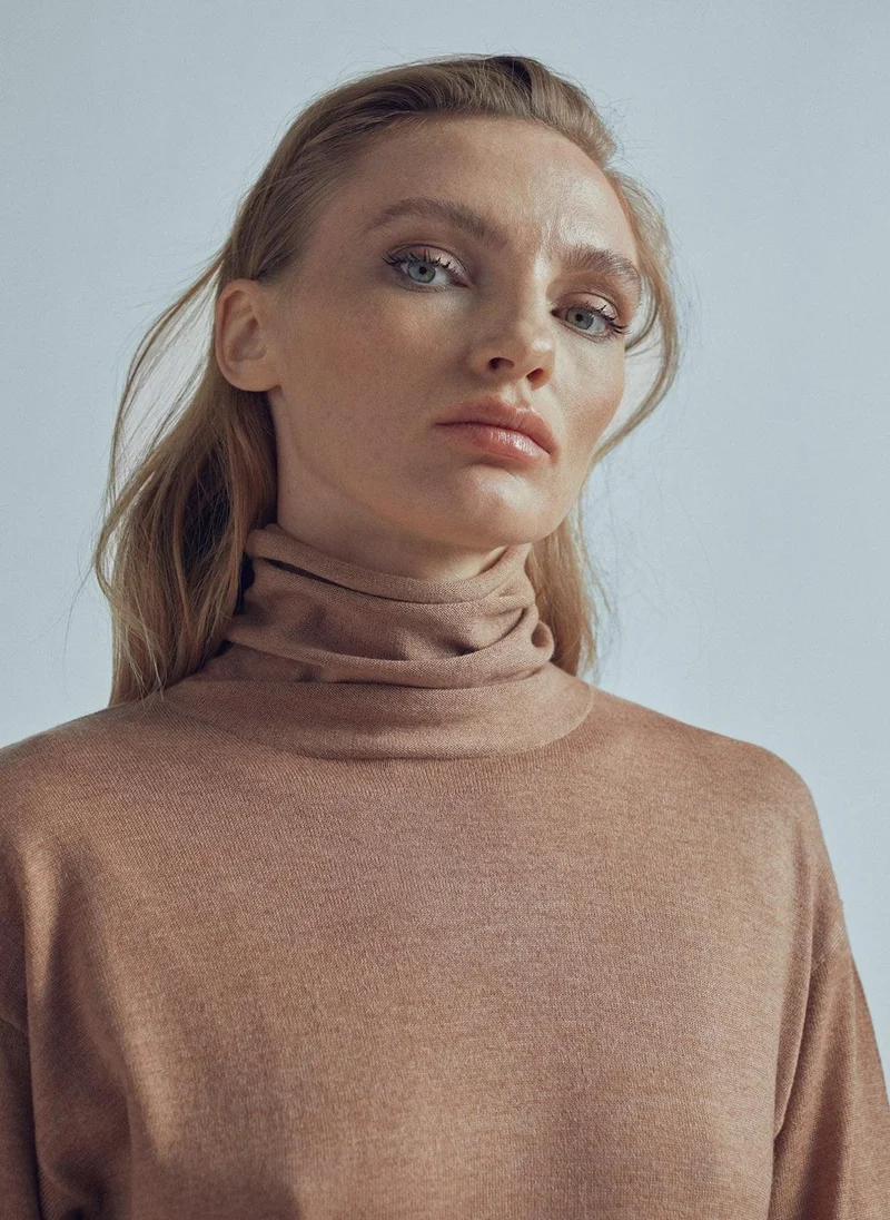 Lola Casademunt Long sweater with a high collar and slit detail