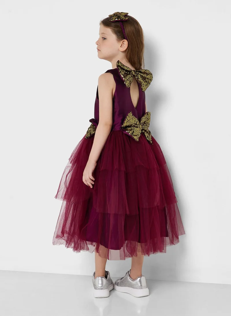 Pinata Party Wear Layered Dress With Bow Detailing On Waist