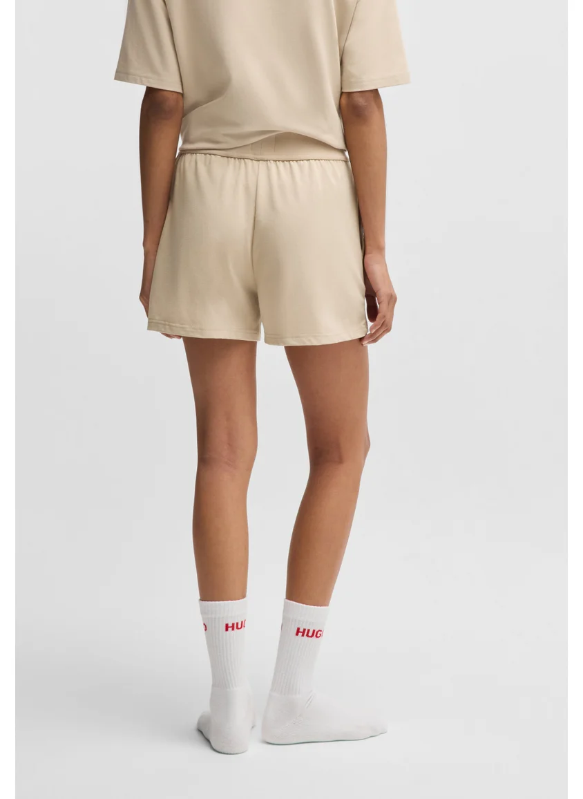 هوجو Relaxed-fit shorts in stretch jersey with printed logo