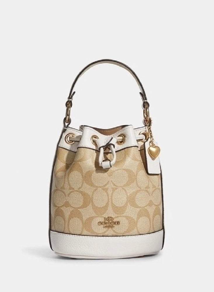 كوتش اوت ليت حقيبة دلو صغيرة من قماش Coach Signature - Image 1