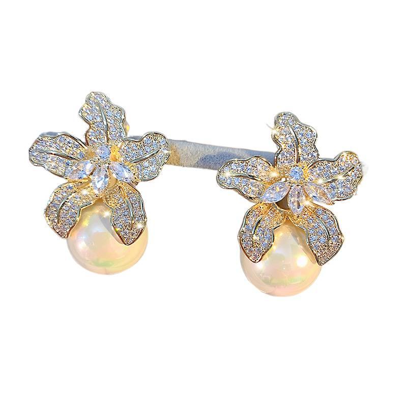 SK Gold Pearl Earrings with Flower Detail and Lightweight Huggie Profile for Daily Wear and Elegant Styling - Image 1