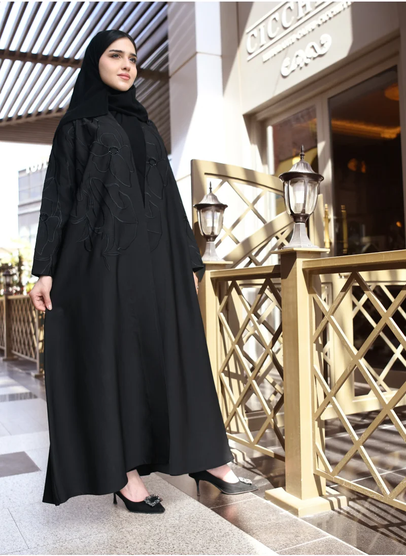 HAWRAA ABAYA A black quarter cloche abaya with luxurious black embroidery and a simple sash at the top of the abaya