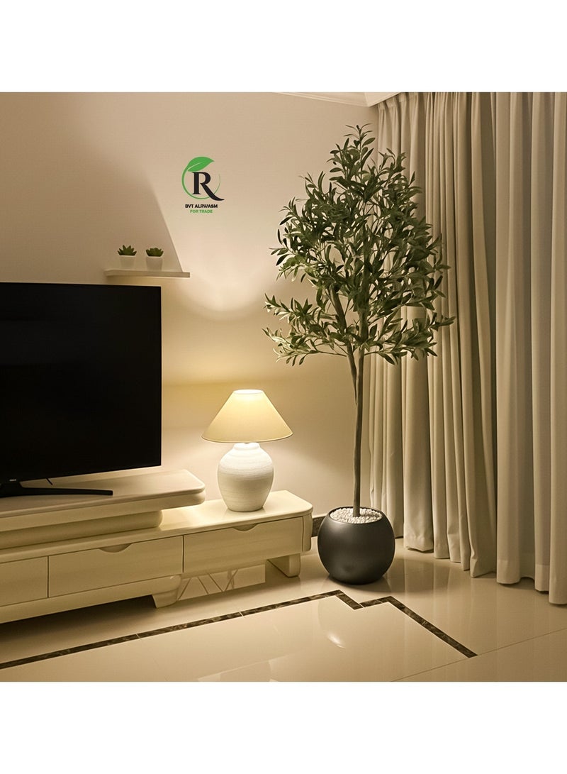 Al-Rawasem House A fruitful olive tree with a large, attractively designed gray pot (180cm x 150cm) will make your home more elegant. - Image 1