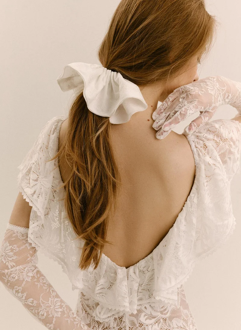 Textile scrunchie with tonal embroidery