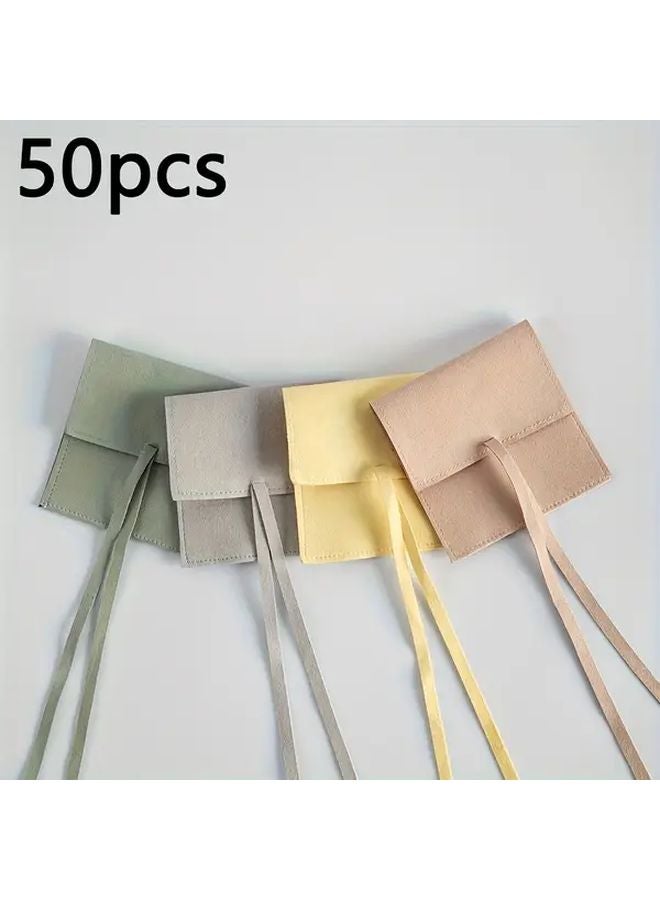 أكياس المجوهرات الباستيل البيضاء الصغيرة 50 حقيبة، أكياس من ميكروفايبر الناعمة بإغلاق شريطي - Image 4