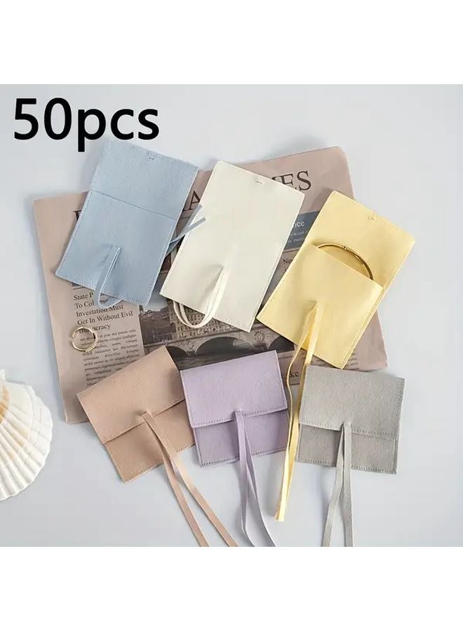 أكياس المجوهرات الباستيل البيضاء الصغيرة 50 حقيبة، أكياس من ميكروفايبر الناعمة بإغلاق شريطي - Image 2