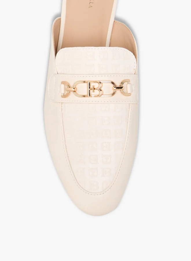 فلورا بيلا من شو إكسبرس Monogram Embossed Mules with Metal Accent
