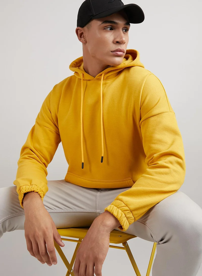 Campus Sutra Men's Mustard Yellow Oversized Pullover Sweatshirt With Kangaroo Pocket