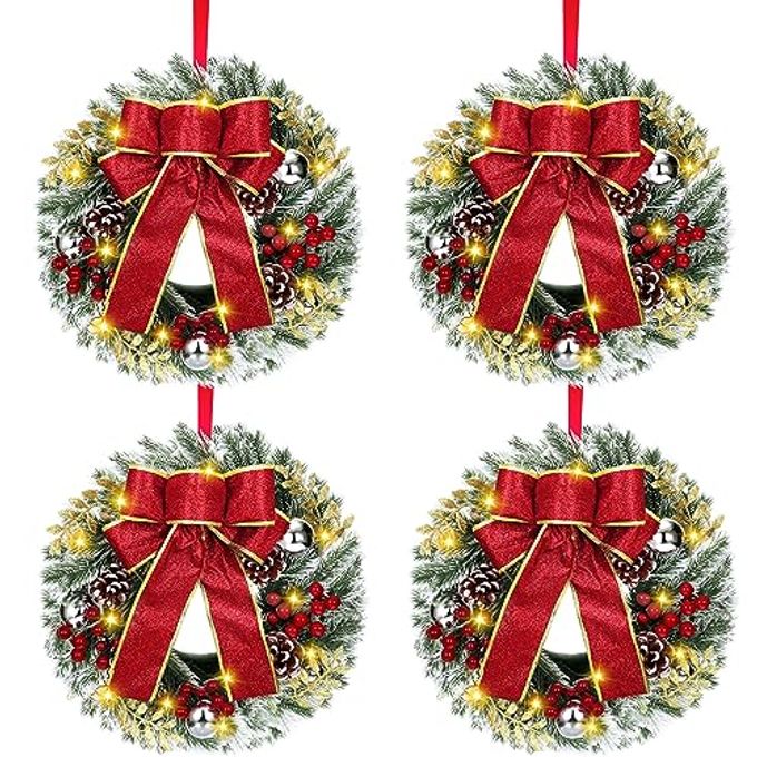 4 PCS LIGHTED CHRISTMAS WREATHS 12 INCH PRE LIT SMALL XMAS WREATH WITH LARGE BOW PINE NEEDLE WREATH WITH LED LIGHTS BATTERY OPERATED XMAS ORNAMENTS FOR FRONT DOOR WALL CHRISTMAS PARTY DECORSILVER